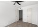 Bright bedroom features ceiling fan, neutral carpet, and ample closet space at 948 S Alma School Rd # 97, Mesa, AZ 85210