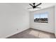 Bedroom with neutral carpet and fan, filled with natural light, creating a calming atmosphere at 948 S Alma School Rd # 97, Mesa, AZ 85210