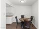 Cozy dining area features a round wood table and four comfortable chairs, ideal for intimate meals at 948 S Alma School Rd # 97, Mesa, AZ 85210