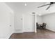 Bright living room showcasing wood floors, ceiling fan, and a dining space at 948 S Alma School Rd # 97, Mesa, AZ 85210