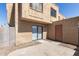 Outdoor patio showcasing a sliding glass door and stucco wall, for outdoor relaxation at 948 S Alma School Rd # 97, Mesa, AZ 85210