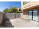Private patio with block wall providing seclusion and featuring a sliding glass door entrance at 948 S Alma School Rd # 97, Mesa, AZ 85210