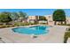 Enjoy the community pool surrounded by lush landscaping and lounging space, perfect for relaxation and recreation at 948 S Alma School Rd # 97, Mesa, AZ 85210