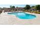 Community pool area offers lounge seating with an outside pool area, and lovely landscaping at 948 S Alma School Rd # 97, Mesa, AZ 85210
