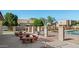Community pool patio with picnic tables, offering an ideal spot for residents to relax and socialize outdoors at 948 S Alma School Rd # 97, Mesa, AZ 85210