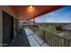 Enjoy sunset city views from this spacious covered balcony with tiled floors and metal railings at 9932 N 16Th E Pl, Phoenix, AZ 85020