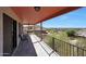 Enjoy beautiful mountain and city views from this spacious covered balcony with tiled floors and metal railings at 9932 N 16Th E Pl, Phoenix, AZ 85020