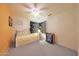 Comfortable bedroom with decorative curtained windows, a ceiling fan, and a bed at 9932 N 16Th E Pl, Phoenix, AZ 85020