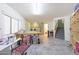 Spacious bonus room with tile floors, natural light, stairs, and access to the rest of the house at 9932 N 16Th E Pl, Phoenix, AZ 85020