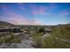 Expansive sunset city view showcasing the neighborhood, landscape, and mountain backdrop offering a sense of location at 9932 N 16Th E Pl, Phoenix, AZ 85020