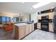 Kitchen has a breakfast bar and is open to the living area at 9932 N 16Th E Pl, Phoenix, AZ 85020