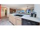 Modern kitchen boasts sleek appliances and an island with sink at 9932 N 16Th E Pl, Phoenix, AZ 85020