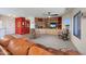 Comfortable living room showcasing built-in shelves and large windows at 9932 N 16Th E Pl, Phoenix, AZ 85020