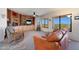 Living room area with a large window providing beautiful city views at 9932 N 16Th E Pl, Phoenix, AZ 85020