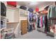 Large walk-in closet with ample shelving and storage for clothes and accessories at 9932 N 16Th E Pl, Phoenix, AZ 85020
