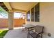 Covered back patio has outdoor seating and offers a great space to relax at 10059 E Tamery Ave, Mesa, AZ 85212