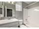 Bathroom features a modern vanity, mosaic tile accent, and shower-tub combo with grey walls at 10059 E Tamery Ave, Mesa, AZ 85212