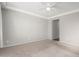 Spacious bedroom features neutral paint, ceiling fan and carpeted floors at 10059 E Tamery Ave, Mesa, AZ 85212
