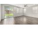 Spacious living room with sliding glass doors, ceiling fan, and tile flooring for easy maintenance at 10059 E Tamery Ave, Mesa, AZ 85212