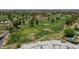 Breathtaking aerial view of the golf course community featuring lush green fairways and mature trees at 1035 N Vista Verde --, Litchfield Park, AZ 85340
