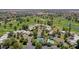 Overhead shot of a residential community with a tennis court, pool, and beautifully landscaped grounds at 1035 N Vista Verde --, Litchfield Park, AZ 85340