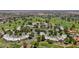 Amazing aerial view of a golf course community showing lush fairways, desert landscaping, and a swimming pool at 1035 N Vista Verde --, Litchfield Park, AZ 85340