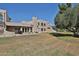 Backyard featuring a patio, lush lawn, and views of the golf course at 1035 N Vista Verde --, Litchfield Park, AZ 85340