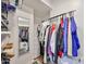 Walk-in closet, including wire shelving, a full-length mirror, drawers, and a place to hang clothes at 1035 N Vista Verde --, Litchfield Park, AZ 85340