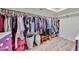 Walk-in closet with hanging storage space along with an additional chair and laundry basket at 1035 N Vista Verde --, Litchfield Park, AZ 85340