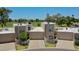 Stunning exterior view of stucco homes showcasing garages, desert landscaping, and a beautiful golf course in the background at 1035 N Vista Verde --, Litchfield Park, AZ 85340