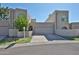 Unique exterior showing multiple windows and garage entrances for this multi-level house at 1035 N Vista Verde --, Litchfield Park, AZ 85340