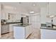 Bright kitchen featuring tiled floors, granite countertops, a skylight, and modern stainless steel appliances at 1035 N Vista Verde --, Litchfield Park, AZ 85340
