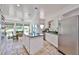 Well-lit kitchen and dining area with stainless appliances and island at 1035 N Vista Verde --, Litchfield Park, AZ 85340