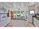 Bright kitchen with an island, granite countertops, and a breakfast nook at 1035 N Vista Verde --, Litchfield Park, AZ 85340