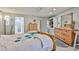 Light filled main bedroom with dresser, storage, and ensuite bathroom at 1035 N Vista Verde --, Litchfield Park, AZ 85340
