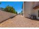 Expansive backyard featuring privacy wall and gravel landscaping for low maintenance at 10386 N 96Th Pl, Scottsdale, AZ 85258