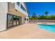 An exterior view shows a spacious backyard with a pool, spa, and large format sliding doors at 10386 N 96Th Pl, Scottsdale, AZ 85258