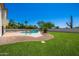 Beautiful backyard with a sparkling pool, well-maintained lawn, and inviting outdoor space at 10386 N 96Th Pl, Scottsdale, AZ 85258