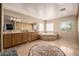 Large bathroom featuring double sinks, lots of cabinet storage and a jacuzzi tub at 10386 N 96Th Pl, Scottsdale, AZ 85258