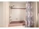 Bathroom with shower and tub featuring a pink tub and shower curtain at 10386 N 96Th Pl, Scottsdale, AZ 85258