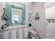 Bright bathroom featuring a tiled wall and modern fixtures in a well-lit space at 10386 N 96Th Pl, Scottsdale, AZ 85258