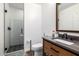 Modern bathroom with glass-enclosed shower, sleek vanity, and contemporary fixtures at 10386 N 96Th Pl, Scottsdale, AZ 85258