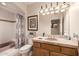 Bathroom featuring tile countertops and tub with shower at 10386 N 96Th Pl, Scottsdale, AZ 85258