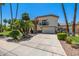 Beautiful two-story home showcasing desert landscaping, a red tile roof, stone accents, and a two-car garage at 10386 N 96Th Pl, Scottsdale, AZ 85258