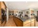 Updated kitchen showcasing an expansive island, stainless steel appliances, and light wood cabinets at 10386 N 96Th Pl, Scottsdale, AZ 85258
