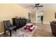 Cozy area featuring wood floors, a dark cabinet, and plush chairs for seating at 10386 N 96Th Pl, Scottsdale, AZ 85258