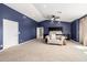 Spacious main bedroom with carpeting, a sitting area, and an ensuite bathroom at 10386 N 96Th Pl, Scottsdale, AZ 85258