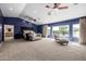 Expansive main bedroom featuring three windows, sitting area and lots of space at 10386 N 96Th Pl, Scottsdale, AZ 85258