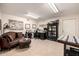 Room showcases an office and sitting area with neutral colors and tile flooring at 10386 N 96Th Pl, Scottsdale, AZ 85258