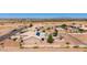 Expansive property featuring a single-Gathering home with solar panels and white fencing in a desert landscape at 10539 W Tamara Dr, Casa Grande, AZ 85193